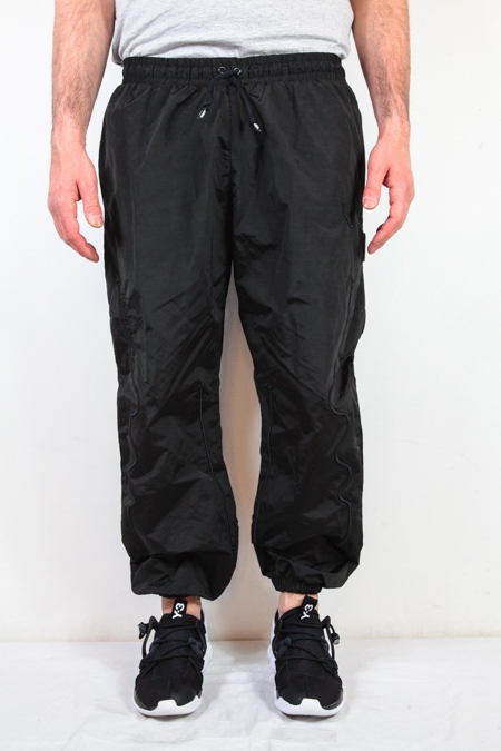 Embroidered Technic' cuffed tapered trousers